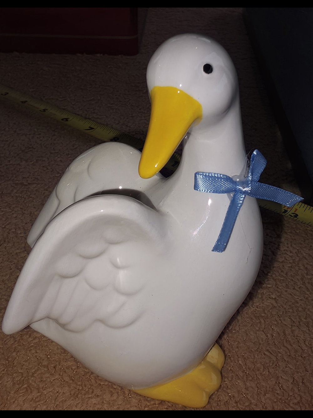 White Ceramic Duck Figurine with Yellow Beak and Blue Bow